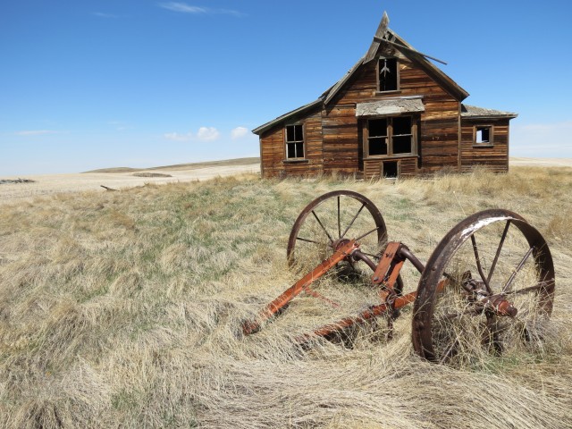 Abandoned house and farm equipment