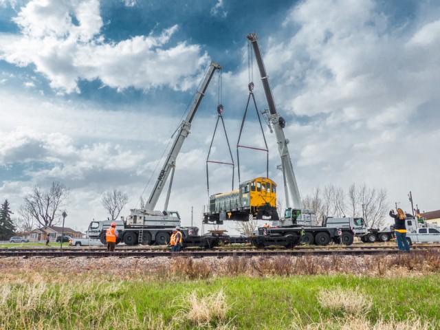 Cranes lifting a locomotive