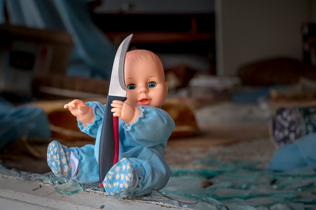 Baby Playing with Knife